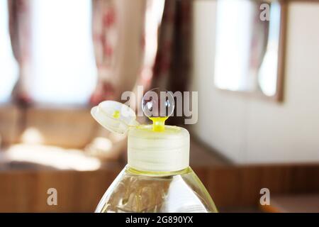 Close up of a small bubble on top of a liquid soap bottle cap Stock Photo