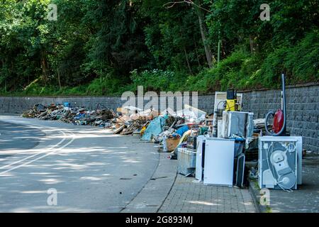 Hagen, Germany. 18th July, 2021. Residents have put the household goods destroyed in the flood on the sidewalk. The city administration can't keep up with the removal because of the amount. Credit: David Inderlied/dpa/Alamy Live News Stock Photo