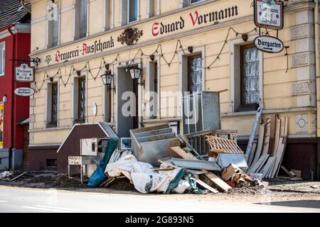 Hagen, Germany. 18th July, 2021. Residents have put the household goods destroyed in the flood on the sidewalk. The city administration can't keep up with the removal because of the amount. Credit: David Inderlied/dpa/Alamy Live News Stock Photo
