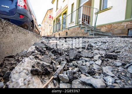 Hagen, Germany. 18th July, 2021. The pavement is broken up due to the masses of water. On the fourth day after the flood, the extent of the destruction becomes visible. Credit: David Inderlied/dpa/Alamy Live News Stock Photo