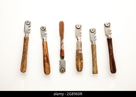 Old glass cutters on a white background, Special glazing tools Stock Photo