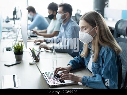 Group of business people wear protective face mask working in office with new normal lifestyle concept Stock Photo