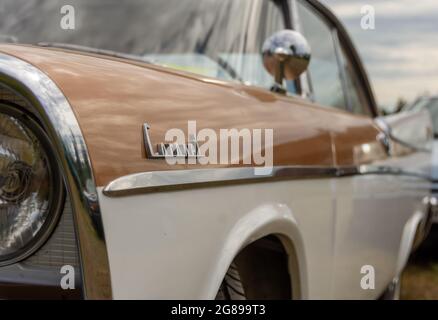 Front light, side mirror and side of an old vintage car. Stock Photo