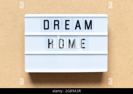 White lightbox with word dream home on wood background Stock Photo