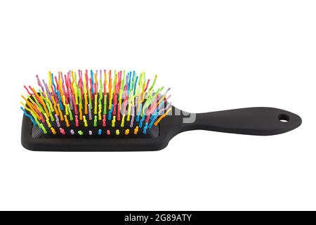 new rainbow colorful pastic hair brush isolated on white background. Stock Photo