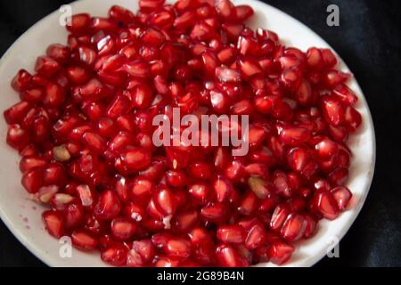 Pomegranates are a beautiful, red fruit filled with seeds Stock Photo