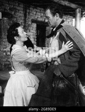 DOROTHY JORDAN and JOHN WAYNE in THE SEARCHERS 1956 director JOHN FORD novel Alan Le May screenplay Frank S. Nugent music Max Steiner executive producer Merian C. Cooper  C.V. Whitney Pictures / Warner Bros. Stock Photo