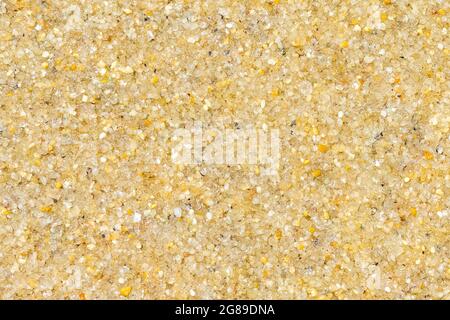 Large grains of sand on a beach, colorful background Stock Photo