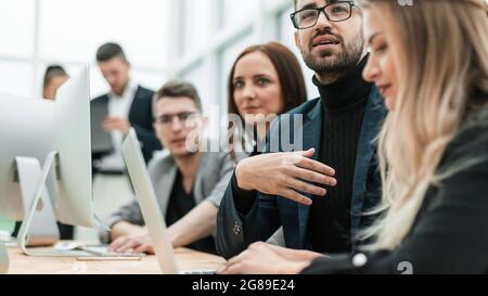 close up. employees work on laptops in a modern office Stock Photo