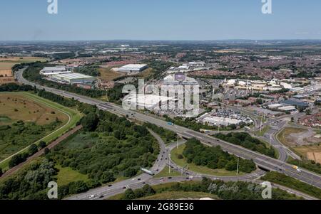 Xscape Castleford, West Yorkshire leisure and retail park, close to the M62 motorway. Aerial  view of the ski slope and motorway including junction Stock Photo
