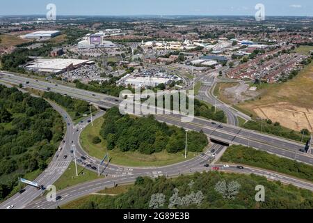 Xscape Castleford, West Yorkshire leisure and retail park, close to the M62 motorway. Aerial  view of the ski slope and motorway including junction Stock Photo
