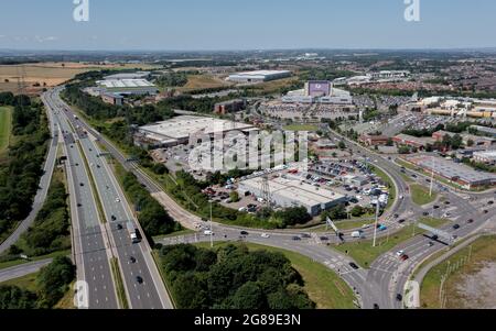 Xscape Castleford, West Yorkshire leisure and retail park, close to the M62 motorway. Aerial  view of the ski slope and motorway including junction Stock Photo