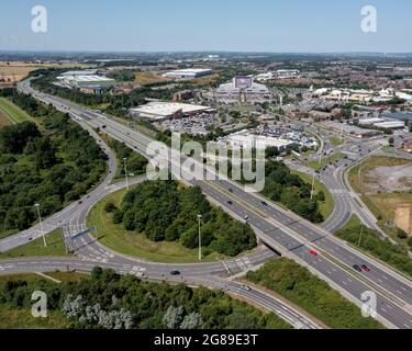 Xscape Castleford, West Yorkshire leisure and retail park, close to the M62 motorway. Aerial  view of the ski slope and motorway including junction Stock Photo