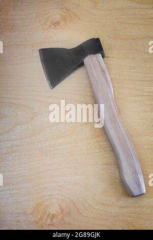 An axe with a wooden axe handle Stock Photo