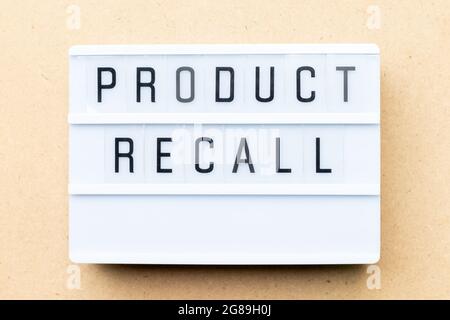 White lightbox with word product recall on wood background Stock Photo