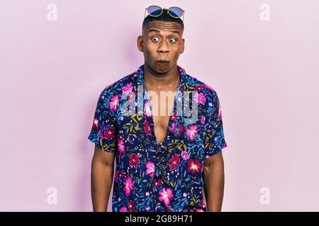 Face of young handsome man wearing Hawaiian shirt Stock Photo - Alamy