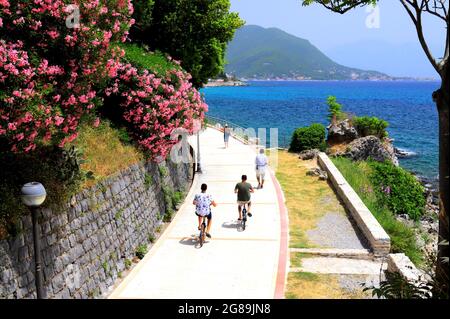The picturesque city Herceg Novi, Montenegro, in the mountains, shore of Kotor. Scenic summer resort landscape in Herceg Novi. People walk and ride Stock Photo