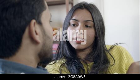 A young Indian couple having a serious conversation about their relationship at home Stock Photo