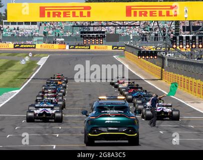 Silverstone Circuit, Silverstone, Northamptonshire, UK. 18th July, 2021. Formula One British Grand Prix, Race Day; The green flag is waved as the red lights come on to start the race Credit: Action Plus Sports/Alamy Live News Stock Photo