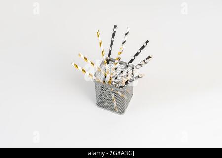 the eco bamboo color straws for the cocktail drinks on the holiday partyon color background Stock Photo