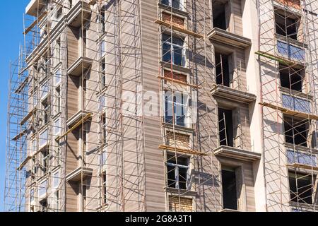 Finishing works on the facade of a new residential buildings Stock Photo