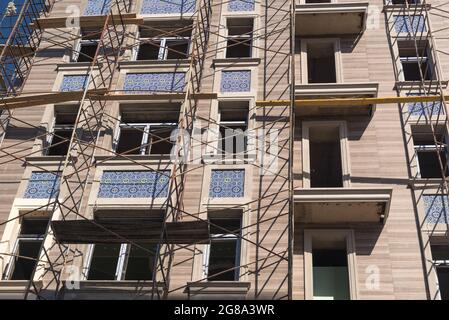 Finishing works on the facade of a new residential buildings Stock Photo