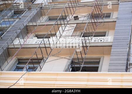 Finishing works on the facade of a new residential buildings Stock Photo