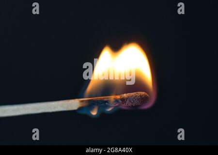match is burning hot on black Stock Photo