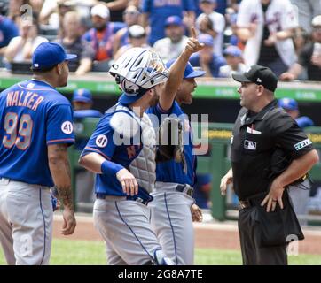 Pittsburgh, United States. 18th July, 2021. New York Mets manager Luis Rojas (19), New York Mets starting pitcher Taijuan Walker (99) and New York Mets catcher Tomas Nido (3) argues with HP Umpire Jeremy Riggs in the first inning against the Pittsburgh Pirates at PNC Park on Sunday, July 18, 2021 in Pittsburgh. Photo by Archie Carpenter/UPI Credit: UPI/Alamy Live News Stock Photo