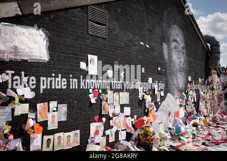 Withington, Manchester, UK. 18th July, 2021. Manchester United player Marcus Rashford mural in Withington, Manchester, England, United Kingdom. The mural was vandalised with abusive graffiti after England's Euro 2020 football loss on July 11th, 2021. The mural was created by French-born street artist Akse on the wall of the Coffee House Cafe on Copson Street. Withington South Manchester. The mural has attracted thousands of messages of support and the number of visiters has led to the road being temporarily closed. Withington, South Manchester. Credit: GARY ROBERTS/Alamy Live News Stock Photo