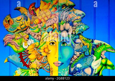 A painting of a woman with flowers and ideas coming out of her head is pictured on the wall of Foxy’s Waffle Bar in Dauphin Island, Alabama. Stock Photo