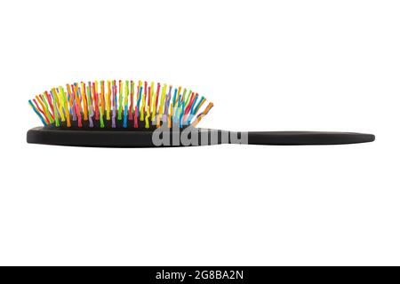 new rainbow colorful pastic hair brush isolated on white background. side view Stock Photo