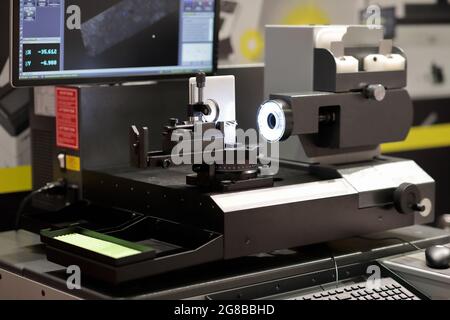 Automatic inspection and measuring equipment for cutting tools. Selective focus. Stock Photo
