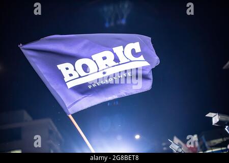 Santiago, Chile. 18th July, 2021. A flag supporting Gabriel Boric flies during the counting of votes at the RD command. Gabriel Boric, the FA candidate, surpasses Jadue with more than one million votes and is elected as the presidential candidate of the left. Boric beat his communist rival Daniel Jadue by over 60%, who could not overcome the 40% barrier. Credit: SOPA Images Limited/Alamy Live News Stock Photo