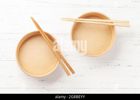 Empty disposable poke bowls and chopsticks. Top view flat lay Stock Photo