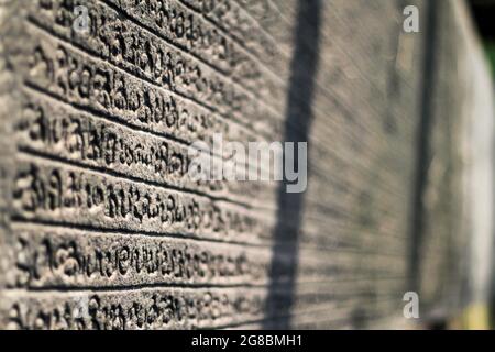 Om - Sanskrit letter in red with multicolored background Stock Photo - Alamy