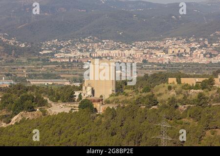 Abandoned, non-functioning cement factory that extracted ore from the mountain. Stock Photo