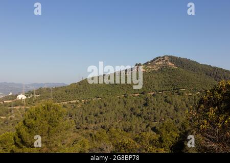 Abandoned, non-functioning cement factory that extracted ore from the mountain. Stock Photo