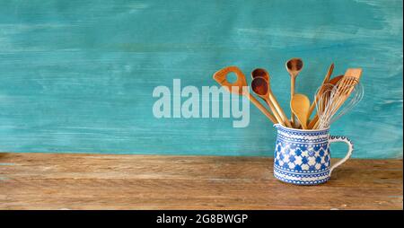 kitchen utensils in a decorated old mug, restaurant,cooking,food template,free copy space Stock Photo