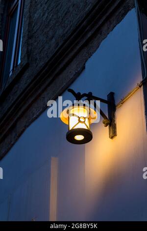 Retro style street lamp in old town. Street lantern at night Stock Photo