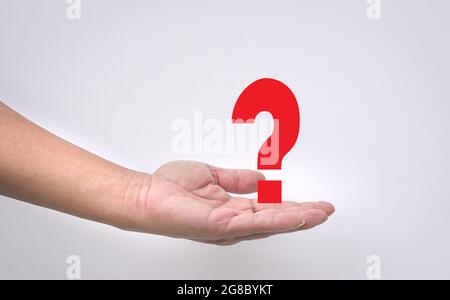 Question mark concept with open hand on white background. Copy space. Stock Photo
