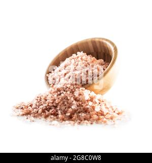 Himalayan pink salt in wooden bowl isolated on white background. Stock Photo