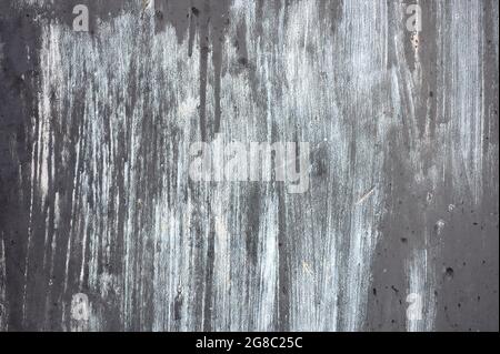 detail of a rusty gray and white texture of a metal door Stock Photo