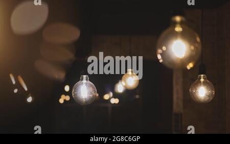 detail of retro style led light bulbs in the shape of a sphere hanging from the ceiling Stock Photo