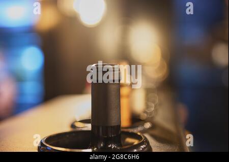 detail of wine bottles placed in a cooler at a restaurant Stock Photo