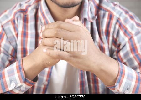 hands of thoughtful young man close up  Stock Photo