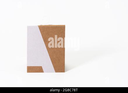 rectangular brown paper tag with sock hook on white background Stock Photo