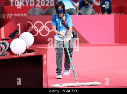 Tokyo, Japan. 19th July, 2021. A staff member cleans the floor at Tokyo Metropolitan Gymnasium in Tokyo, Japan, July 19, 2021. Credit: Wang Dongzhen/Xinhua/Alamy Live News Stock Photo