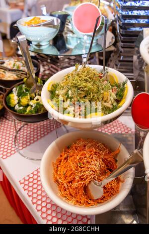 spicy salads of the cafe on the buffet table. Stock Photo