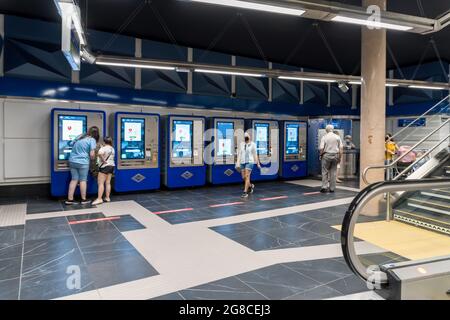 MADRID, SPAIN - Jul 16, 2021: Modern machines in the Reopening of the modern Gran Via metro station in Madrid, Spain Stock Photo